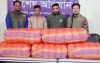 কাভার্ডভ্যানের পাটাতন কাটতেই বেরিয়ে এলো ৬০ কেজি গাঁজা!